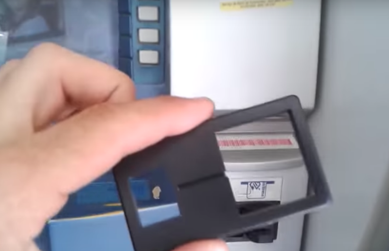  Image 2: An example of a card reader overlay taken from an ATM in Brazil. The overlay is associated with EMV chip-punching; a mechanism inside the card slot would physically punch out the chip from a card after it was inserted into an ATM. 